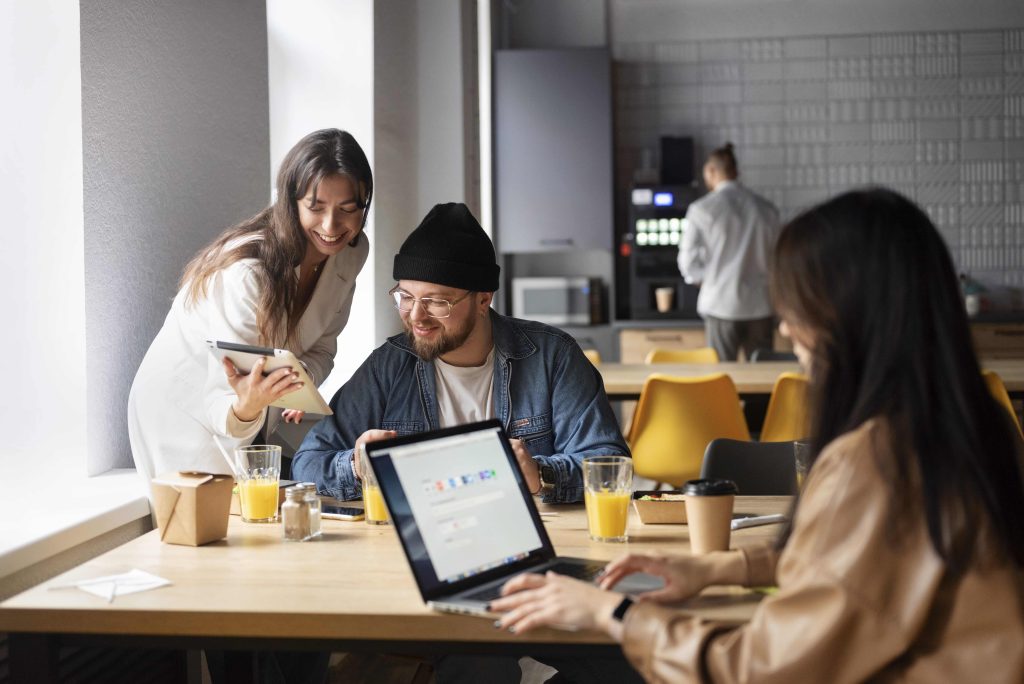 Alt text: A diverse group of young Vietnamese startup founders collaboratively working in a modern office.