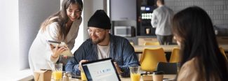 Alt text: A diverse group of young Vietnamese startup founders collaboratively working in a modern office.