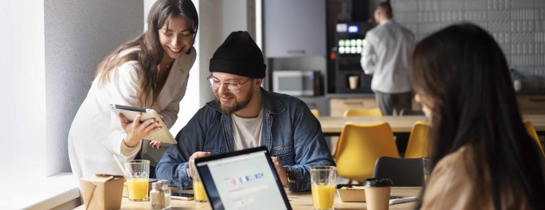 Alt text: A diverse group of young Vietnamese startup founders collaboratively working in a modern office.