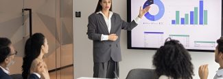 A professional navigating the complexities of AWS Database Migration Service pricing on a detailed dashboard.