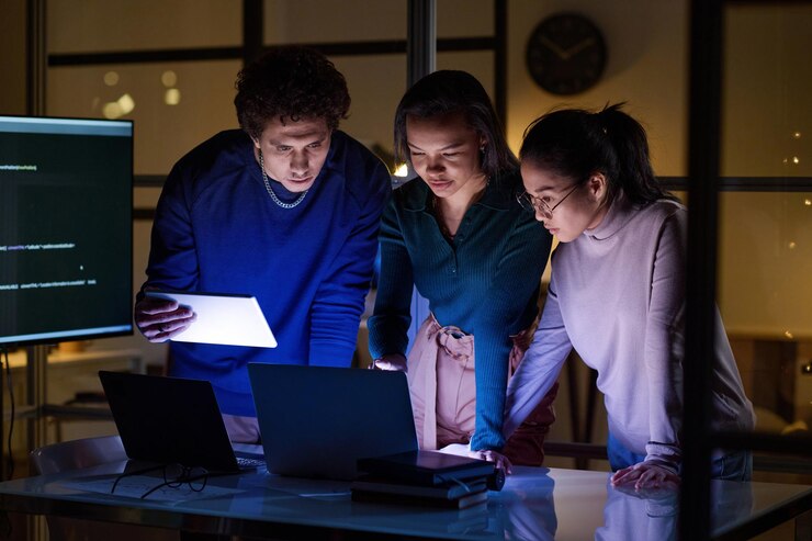 A tech team collaborating with an AWS Managed Service Provider to monitor and optimize the cloud environment.